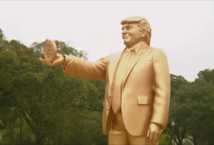 Golden Statue Of Trump Holding Bitcoin Appears Outside Capitol
